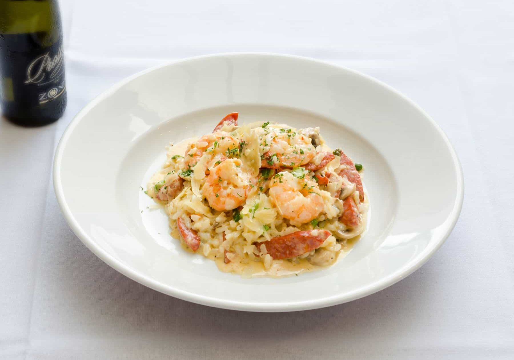 Shrimp And Lobster Risotto Garnished With Herbs.
